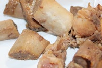 a plate of meat on a white plate