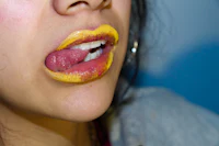 a woman with a yellow tongue